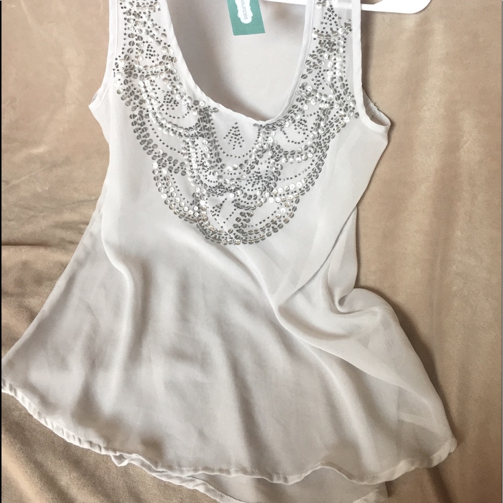 Comfy sheer tank with sparkle details.